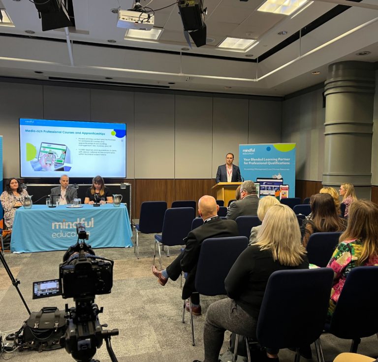 Delegates at the AoC Annual Conference 2022 watching Mindful Education's Managing Director, Mark McKenna deliver a breakout session.