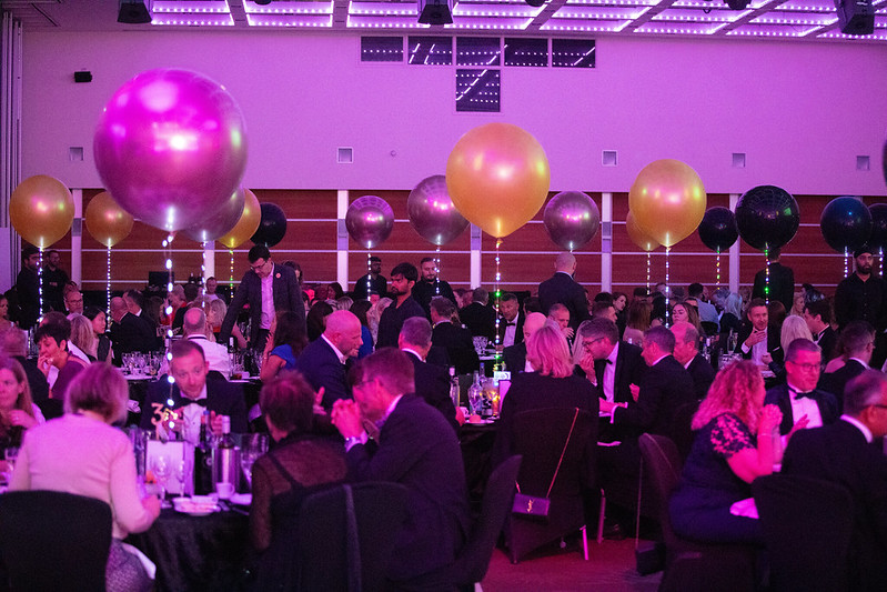 An image showing event delegates sat down at tables during a gala dinner.