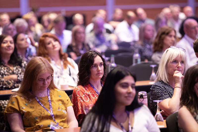 An Image showing a crowd sitting and watching a break-out sessions, among them is Mindful Educations Head of Employer Engagement, Katherine McKenna.