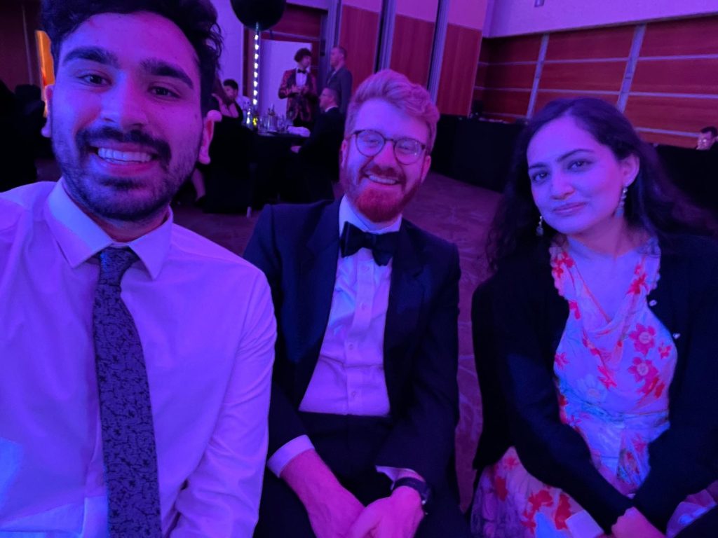 A selfie of three Mindful Education employees at a post event gala dinner.