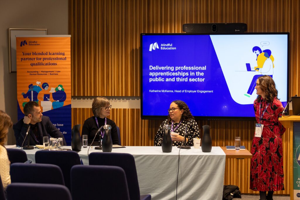 A Mindful Education employee alongside a panel of professionals within the Further Education industry, discussing the topic of public and third sector apprenticeships.