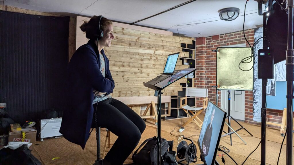 A member of the Mindful Education production team in a filming studio observing content produced for Mindful Educations professional courses and apprenticeships.