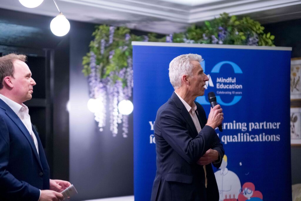 An image showing experts in the further education sector speaking to various professional partners at Mindful Education's 10th anniversary drinks reception.