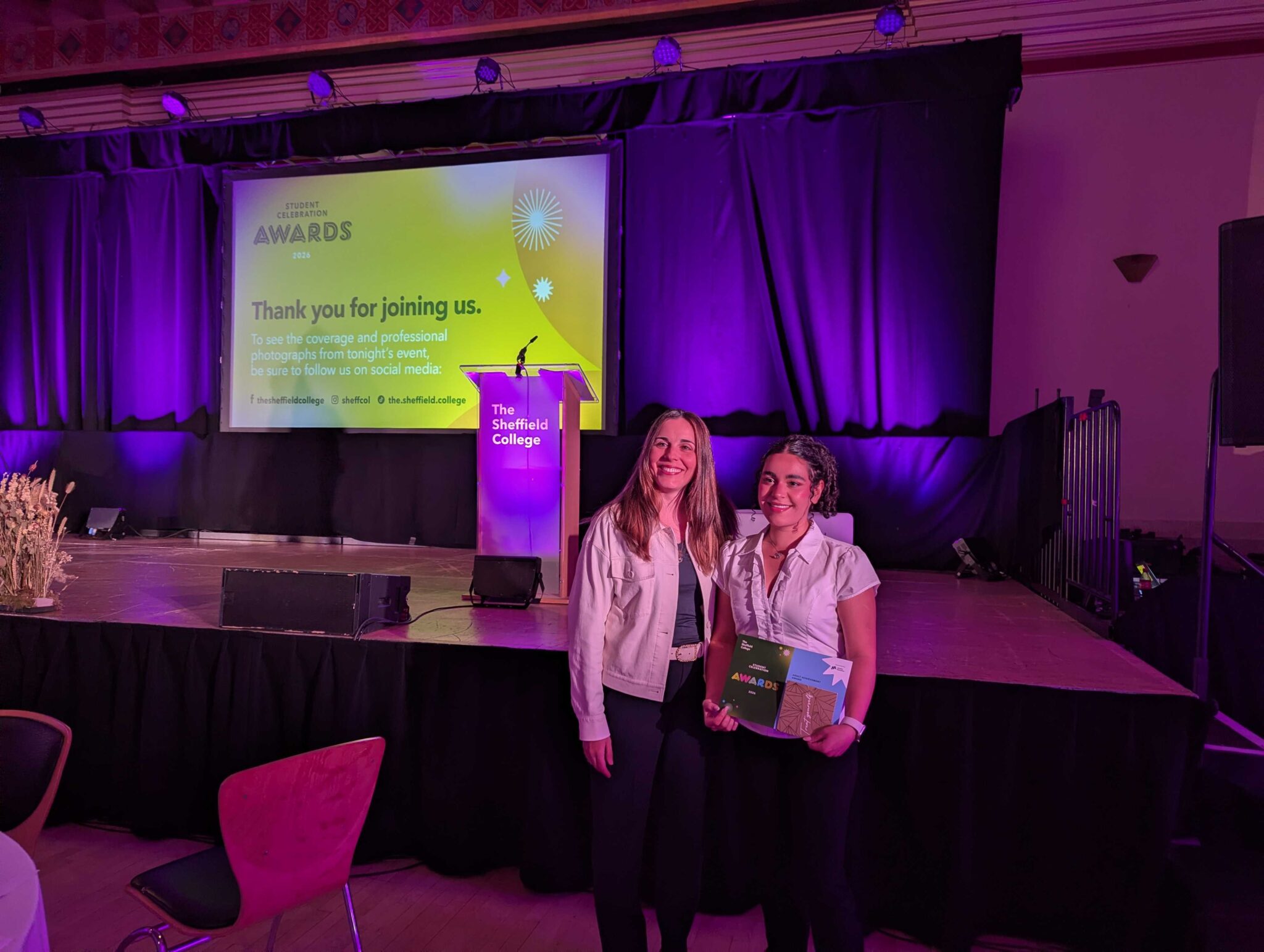 A Mindful Education employee with a learner who has won an award